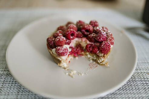 Delicious raspberry cake on plate on table - CHPF00862