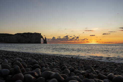 Silhouette of Porte d'Aval rock and beach at sunset - CHPF00863