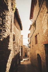 Empty alley amidst houses at Roda De Isabena, Spain - ACPF01547