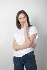 Young woman standing over white background - LMCF00032