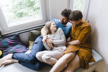 Father and mother talking to daughter at home - JOSEF17041