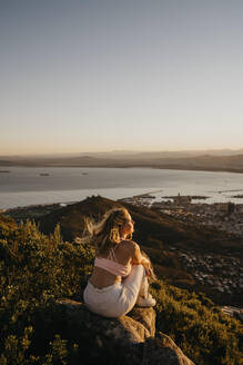 Woman looking at sea from Lion's Head Mountain - LHPF01512