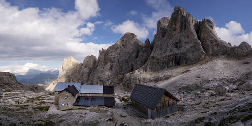 Houses in front of Cima del Focobon mountain at Rifugio Mulaz, Dolomites, Italy - ALRF02072