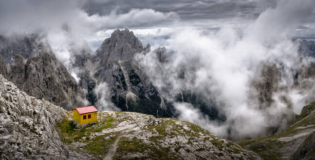 Scenic view of mountains under cloudy sky at Bivacco Milnazio, Dolomites, Italy - ALRF02083