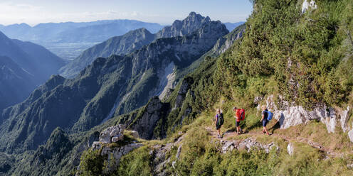 Hikers walking in Piazza del Diavolo Nature Reserve , Dolomites, Italy - ALRF02086