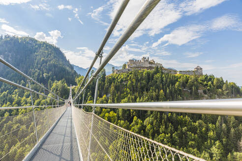 Austria, Tyrol, Reutte, Ehrenberg Castle seen from suspension bridge - AIF00770