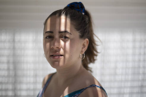 Young woman with shadow on face - AXHF00280