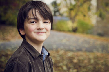 Cute boy smiling at park - PWF00780