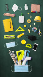 Flat lay top view of face mask, respirator and school supplies, back to school and coronavirus concept. - HPIF06467