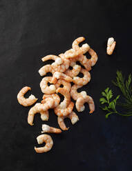 Ready-to-eat shrimps on black background - KSWF02313