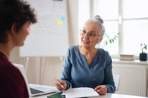 A senior woman recruiter smiling during the job interview. - HPIF07027