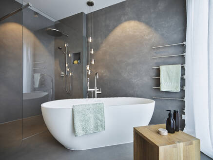 Empty bath tub arranged in bathroom of modern apartment - RORF03416