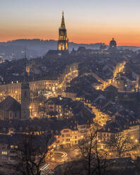 Switzerland, Bern Canton, Bern, View of illuminated old town in morning - KEBF02631