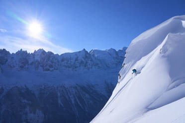 Man skiing on snowcapped mountain - JAHF00208