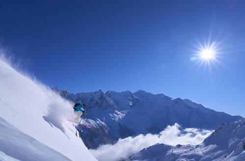 Skier jumping on snowy slope - JAHF00257