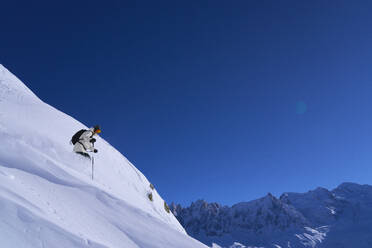 Woman skiing down on slopes - JAHF00258