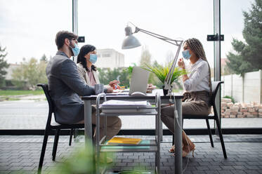 A young woman having job interview in office, business, career and coronavirus concept. - HPIF08161