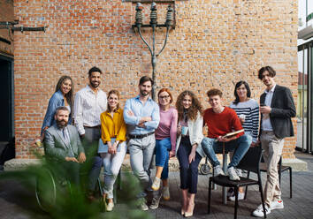 Portrait of group of entrepreneurs looking at camera indoors in office, inclusion of disabled ceoncept. - HPIF08211