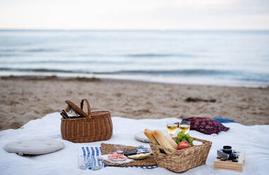 A beach picnic with schripms, beer, candles. - HPIF09258