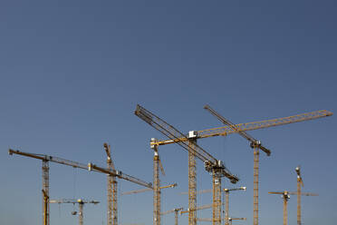 Industrial cranes against clear sky - ASCF01735