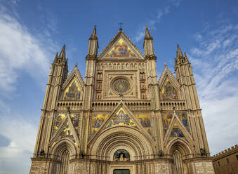 Famous Cathedral of Santa Maria Assunta in front of sky, Orvieto, Italy - MAMF02609