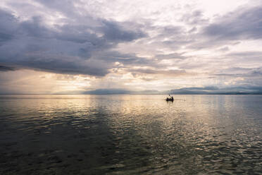 Sea under cloudy sky at sunset - PNAF05031