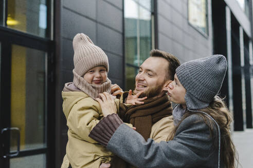 Smiling mother and father enjoying with son - SEAF01801