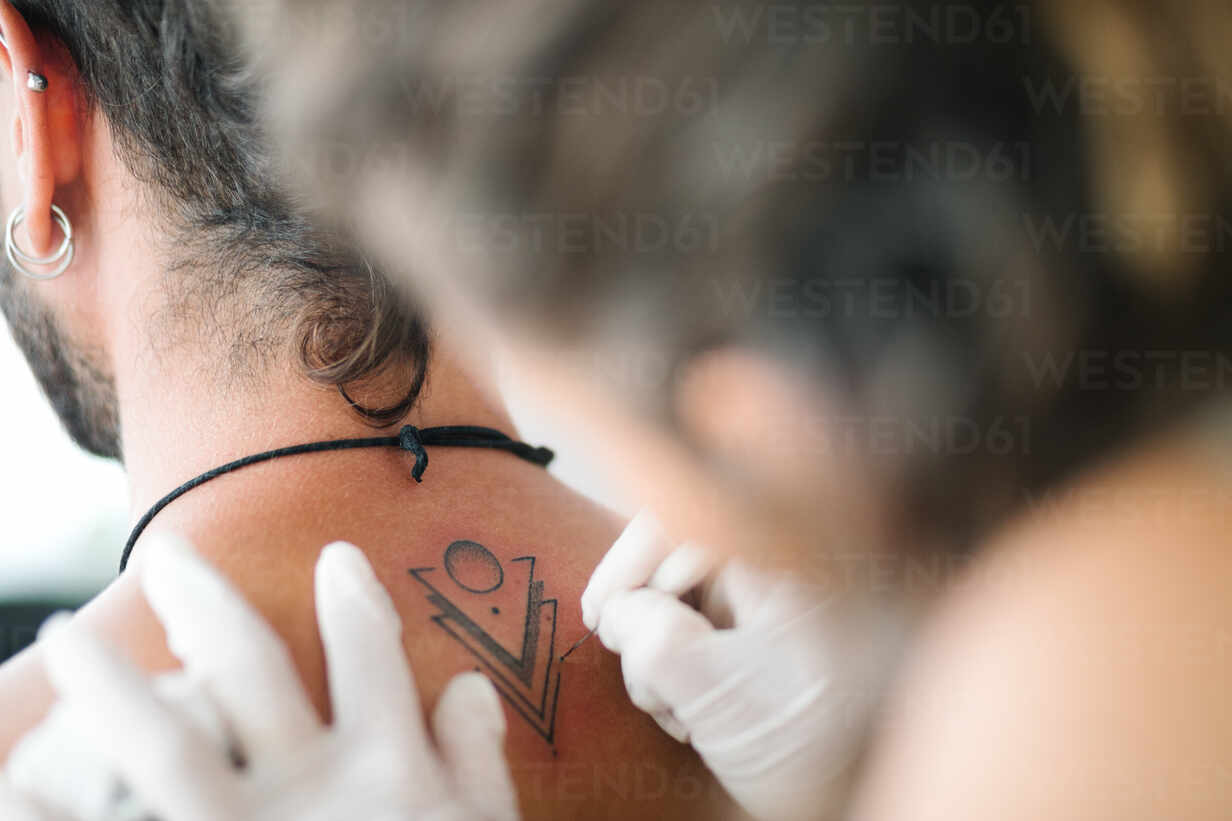 Little Tattoos — Minimalist cross tattoo on the back of the neck....