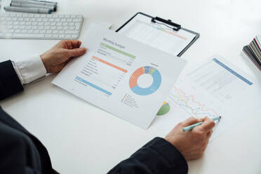 Businesswoman working on documents at desk - VPIF08003