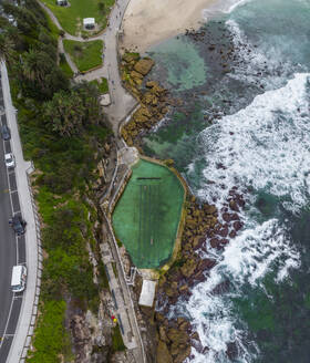 Aerial view of Bronte Baths, an oceanside saltwater pool, Sydney, New South Wales, Australia. - AAEF17420