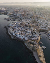 Aerial view of Monopoli old town with Carlo V castle along the port, Bari, Puglia, Italy. - AAEF17438