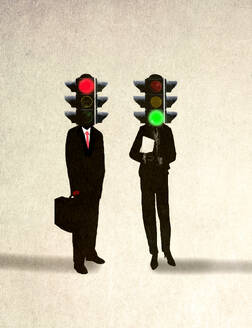 Businessman and businesswoman with traffic signals on head against beige background - GWAF00086