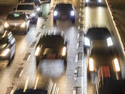 Germany, Baden-Wurttemberg, Stuttgart, Blurred motion of traffic jam on multiple lane highway at night - WDF07285