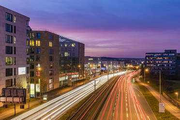 Germany, Baden-Wurttemberg, Stuttgart, Vehicle light trails on Bundesstrasse 27 at dusk - WDF07287