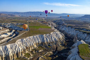 Aerial view of hot air balloons in Cappadocia, Turkey. - AAEF17578