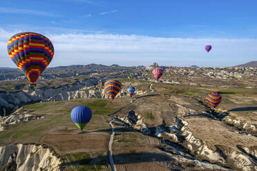 Aerial view of hot air balloons in Cappadocia, Turkey. - AAEF17580