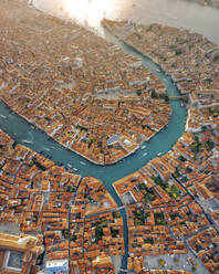 Aerial panoramic view of the grand canal crossing Venice downtown at sunset, Veneto, Italy. - AAEF17637
