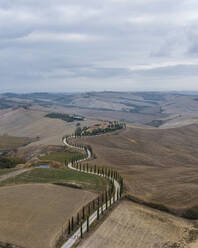 Aerial view of Crete Senesi, a characteristic hilly landscape with cypress trees in Val d'Orcia, Asciano, Siena, Tuscany, Italy. - AAEF17646