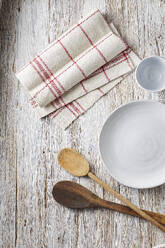 Empty bowl, cup, dish towel and wooden spoons - KSWF02346