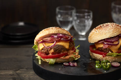 Studio shot of two ready-to-eat hamburgers - KSWF02356