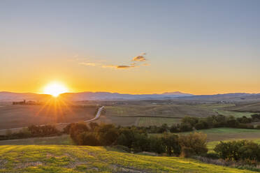 Italy, Tuscany, Castiglione d'Orcia, Sun rising over Val d'Orcia - FOF13632