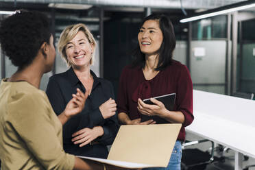 Happy businesswomen having fun in office - JOSEF17817