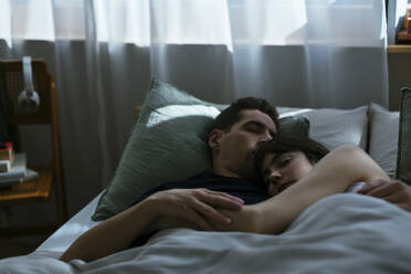 Couple sleeping in bedroom together - EBSF02994