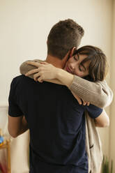 Woman embracing man at home - EBSF03003