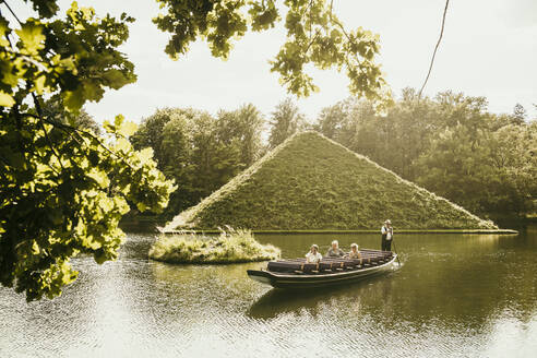 Tourists spending vacation in boat at Park Branitz, Cottbus, Germany - MJRF01008