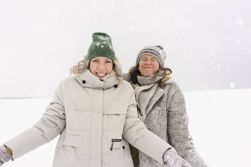 Happy women enjoying in snow - SEAF01868