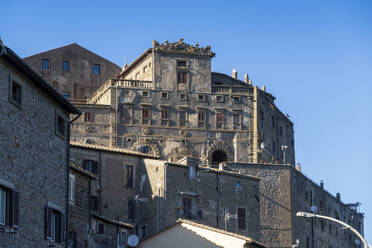 Exterior of building under blue sky on sunny day - MAMF02722