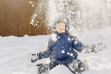 Happy boy enjoying in snow - SEAF01873