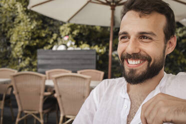 Happy young man in cafe - PCLF00306