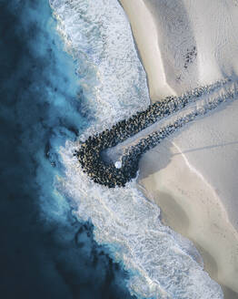 Aerial view of a breakwater pier on Nanarup little beach, Albany, Western Australia, Australia. - AAEF17744